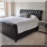 F31. King Chesterfield style leather sleigh bed.  